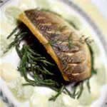 Seared fillet of sea bass, marsh samphire with samphire sauce and butter sauce – by Adrian Coulthard