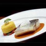 Sea bass with essence of sweetpepper, polenta and goats' cheese gnocchi – by Simon Radley