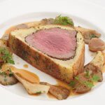 Baked fillet of Buccleuch beef, brioche, mustard and herb crust, button onion and oyster mushroom fricassee, by Simon Young