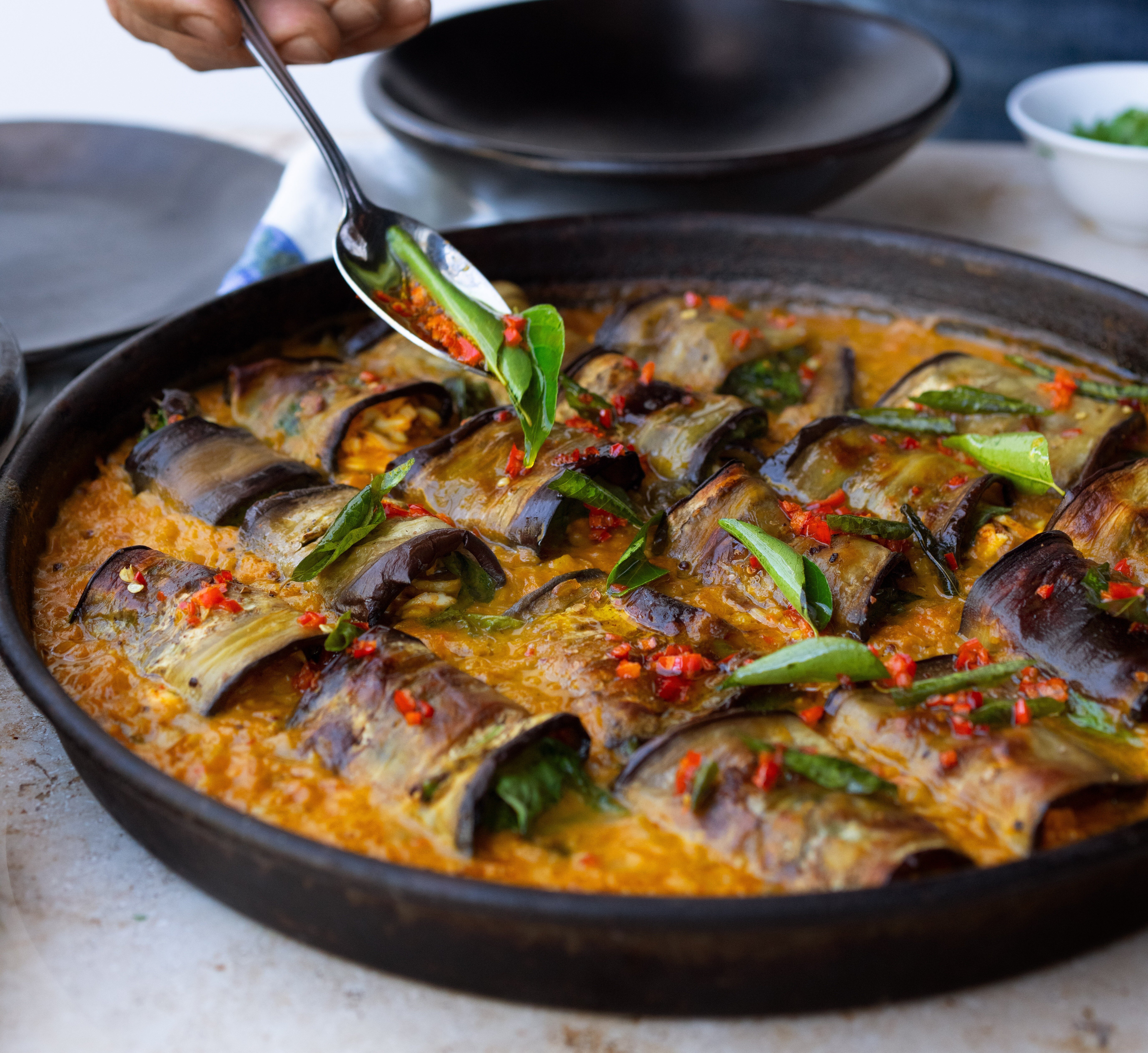 Recipe: Yotam Ottolenghi's stuffed aubergine in curry and coconut dal