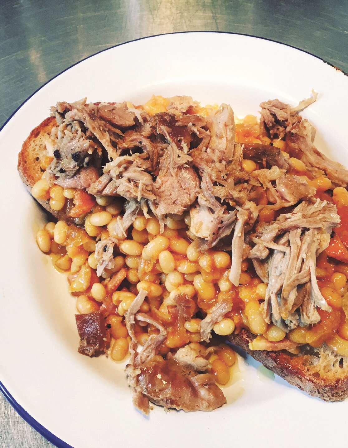 Recipe: Slow-roast pork shoulder with paprika, mustard and baked beans