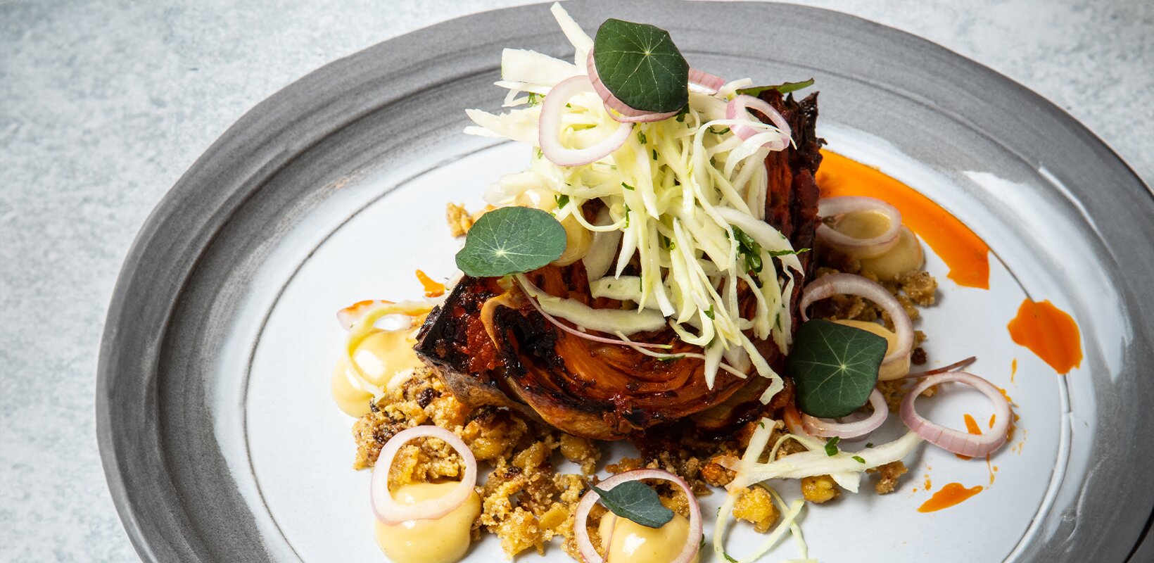 Recipe: Chantelle Nicholson’s harissa-roasted cabbage, miso aioli, pickled shallots, crispy chickpea