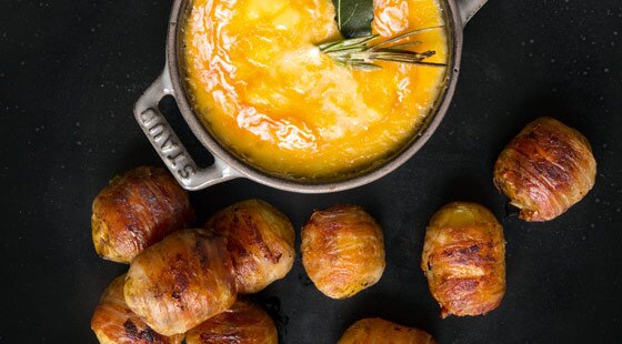 Recipe of the week: Baked Langres and pancetta-wrapped potatoes