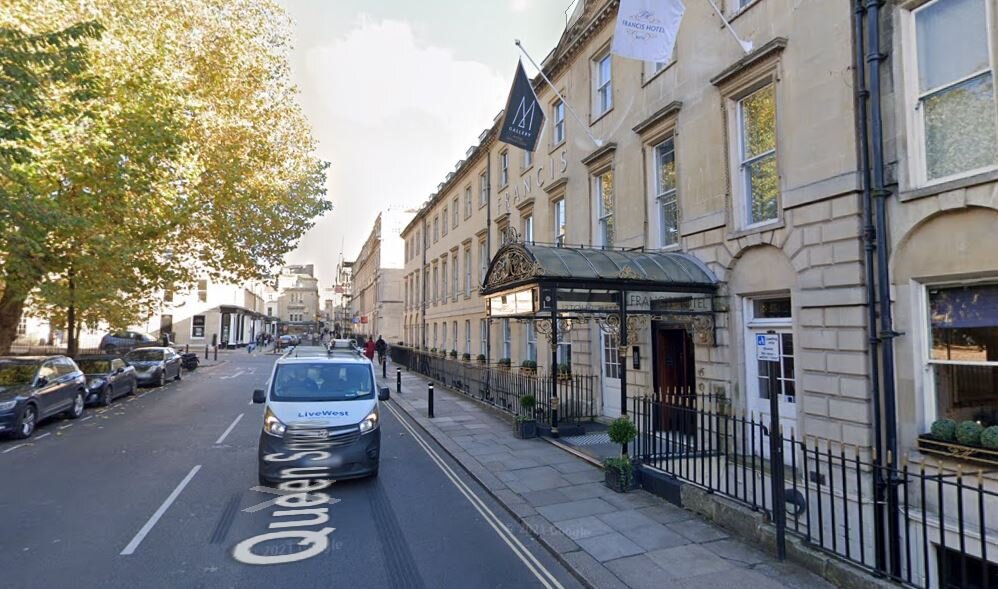 Car wedged against basement of Bath hotel removed