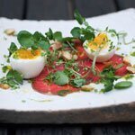 Mustard seed smoked Red Poll beef with soft-boiled duck egg and cobnuts, by Madalene Bonvini-Hamel