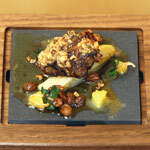 Pan-fried duck foie gras with braised chicory with orange and raisins, by Michael Caines