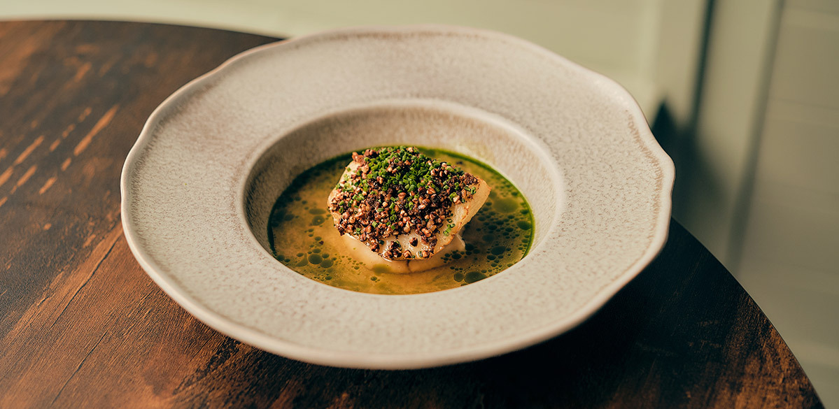 Salt-baked celeriac, celeriac skin, woodruff consomm&eacute;, fried brioche and buckwheat