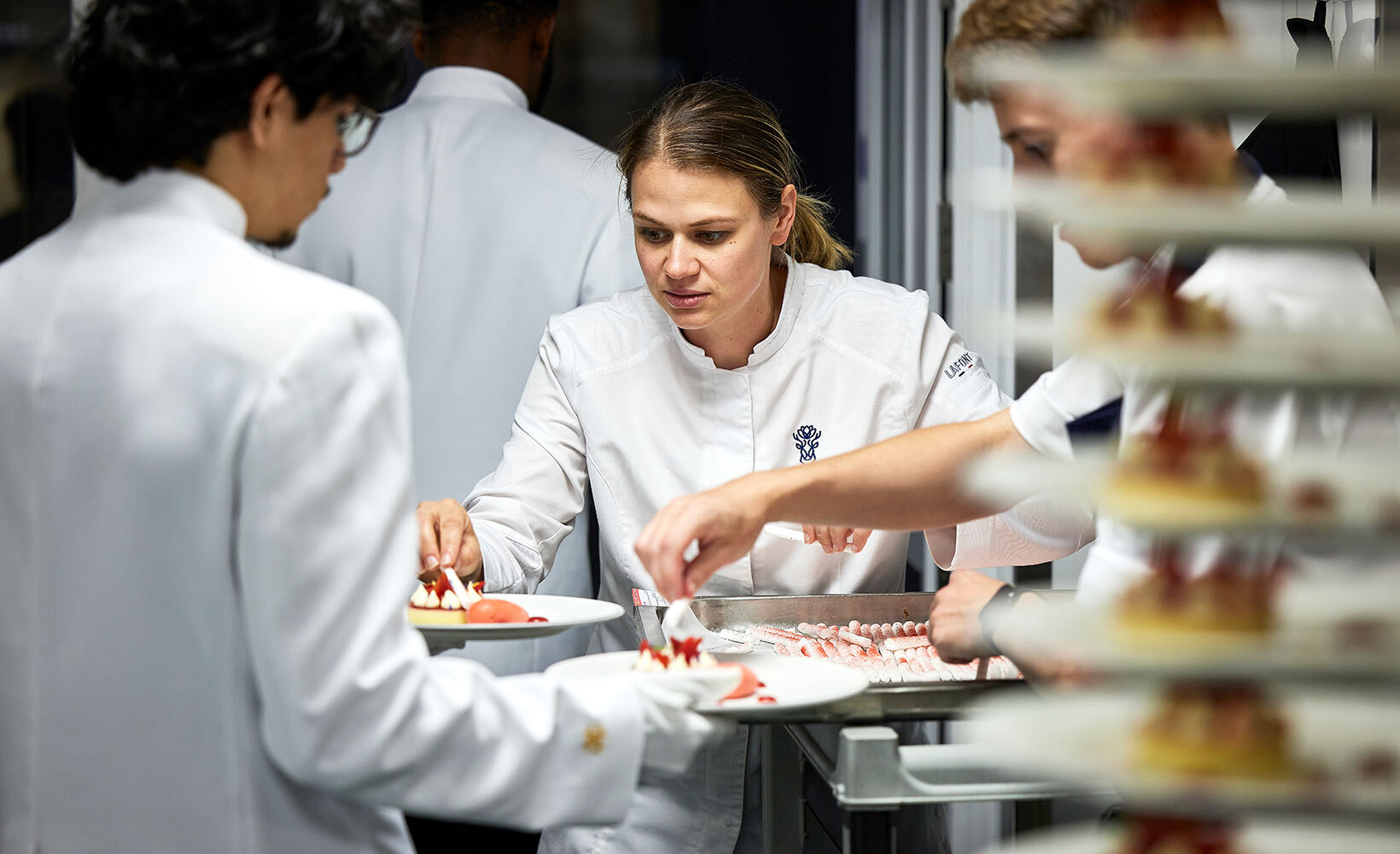 Sarah Frankland, executive chef at Pennyhill Park, adds the finishing touch to a dessert of Eton mess with Pennyhill Park honey, New Forest strawberries and an English apple cider balsamic sorbet
